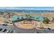 Aerial view of the community clubhouse, showcasing ample parking and meticulously manicured landscaping at 15123 Xenia St, Thornton, CO 80602