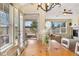 Inviting dining area with light-filled windows and a beautiful view of the outdoors at 15123 Xenia St, Thornton, CO 80602