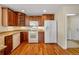 Spacious kitchen with ample cabinet space and modern white appliances at 15123 Xenia St, Thornton, CO 80602