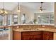 Open-concept kitchen with granite countertops and a view of the living area at 15123 Xenia St, Thornton, CO 80602
