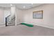 Basement features a putting green and a staircase at 2730 Fox View Trl, Franktown, CO 80116