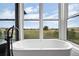 Relaxing bathroom with a freestanding soaking tub and scenic views at 2730 Fox View Trl, Franktown, CO 80116