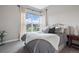 Bright bedroom with large window and plush bedding at 2730 Fox View Trl, Franktown, CO 80116