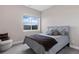 Comfortable bedroom with a queen-size bed and an armchair at 2730 Fox View Trl, Franktown, CO 80116