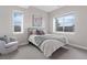 Bright bedroom with a queen bed and access to a bathroom at 2730 Fox View Trl, Franktown, CO 80116