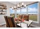 Bright dining room with large windows and scenic views at 2730 Fox View Trl, Franktown, CO 80116