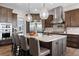 Gourmet kitchen with dark cabinetry and a marble island at 2730 Fox View Trl, Franktown, CO 80116