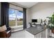 Home office with large window and L-shaped desk at 2730 Fox View Trl, Franktown, CO 80116