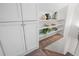 Hall closet with built-in shelving offers extra storage space on the upper level at 3426 N Gilpin St, Denver, CO 80205