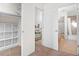 Hallway between closet, bath, and bedroom offers seamless transition between spaces, enhancing convenience and functionality at 3426 N Gilpin St, Denver, CO 80205