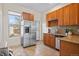 Bright and airy kitchen features stainless steel appliances and stylish tile flooring at 3426 N Gilpin St, Denver, CO 80205