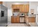 Spacious kitchen with stainless steel refrigerator, ample counter space and modern appliances at 3426 N Gilpin St, Denver, CO 80205