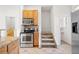 Functional kitchen with stainless steel oven, microwave, and ample cabinet space at 3426 N Gilpin St, Denver, CO 80205