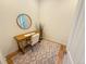 Bright office space with wooden desk, accent rug, and natural light for work or study at 3426 N Gilpin St, Denver, CO 80205
