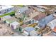 Backyard aerial view featuring well-maintained lawns, patios, and detached garages at 3426 N Gilpin St, Denver, CO 80205