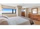 Main bedroom with stunning city views and wood dresser at 100 Park W Ave # 1804, Denver, CO 80205