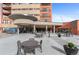 Welcoming entrance to 100 Park Avenue West with outdoor seating at 100 Park W Ave # 1804, Denver, CO 80205