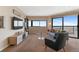 Living room with city views and modern furniture at 100 Park W Ave # 1804, Denver, CO 80205