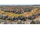 A beautiful aerial view of a community neighborhood in autumn with colorful trees and walking paths at 11023 Glengate Cir, Highlands Ranch, CO 80130