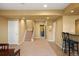 Finished basement area with carpeted stairs and tiled bar area at 11023 Glengate Cir, Highlands Ranch, CO 80130