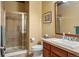 Bathroom with glass-enclosed shower and neutral tile at 11023 Glengate Cir, Highlands Ranch, CO 80130