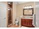 Bathroom featuring a glass enclosed shower with tile and wood vanity at 11023 Glengate Cir, Highlands Ranch, CO 80130