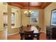 Bright dining room with large windows and comfortable seating area at 11023 Glengate Cir, Highlands Ranch, CO 80130