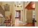 Inviting foyer with hardwood floors, grand staircase, and decorative wall accents at 11023 Glengate Cir, Highlands Ranch, CO 80130