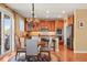 Cozy kitchen with a small dining table, stainless steel appliances, and island at 11023 Glengate Cir, Highlands Ranch, CO 80130