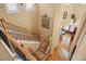 Staircase with decorative metal railing and wooden banister at 11023 Glengate Cir, Highlands Ranch, CO 80130