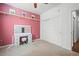 Bedroom with soft pink walls, white trim, carpet, and view of closet and hallway at 4604 Copeland Cir # 101, Highlands Ranch, CO 80126