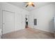 Bedroom with closet, ceiling fan, and neutral walls with connecting door at 4604 Copeland Cir # 101, Highlands Ranch, CO 80126