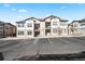 Modern multi-unit building with well-maintained landscaping and convenient parking at 4604 Copeland Cir # 101, Highlands Ranch, CO 80126