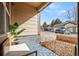 Relaxing covered patio area features comfortable seating and views of the surrounding landscape at 4604 Copeland Cir # 101, Highlands Ranch, CO 80126