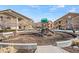 A well-maintained community playground surrounded by condominium buildings at 4604 Copeland Cir # 101, Highlands Ranch, CO 80126