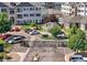 Wide aerial shot of the complex highlighting parking, pool, playground, and community gathering spaces at 15700 E Jamison Dr # 8-208, Englewood, CO 80112