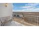 Balcony with wicker bench providing serene outdoor relaxation and a view of the neighborhood at 15700 E Jamison Dr # 8-208, Englewood, CO 80112