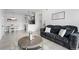 Comfortable living room showcasing an open floor plan with a kitchen and dining area at 15700 E Jamison Dr # 8-208, Englewood, CO 80112