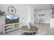 Bright living room next to dining area featuring modern decor and a TV console at 15700 E Jamison Dr # 8-208, Englewood, CO 80112