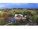 Aerial view of outdoor music venue with stage and crowd surrounded by green spaces at 1020 S Ammons Cir, Lakewood, CO 80226