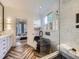 Luxurious bathroom with modern fixtures, standalone tub, and separate glass shower at 1020 S Ammons Cir, Lakewood, CO 80226