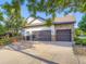 Spacious driveway and three-car garage, providing ample parking and storage at 1020 S Ammons Cir, Lakewood, CO 80226