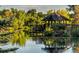 Scenic pond view with a gazebo and lush greenery reflecting in the calm water at 1020 S Ammons Cir, Lakewood, CO 80226
