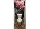 Stylish powder room featuring floral-themed wallpaper and neutral-toned flooring and is well-lit at 1020 S Ammons Cir, Lakewood, CO 80226