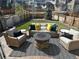 Cozy backyard featuring a stone fire pit, comfortable seating, and a well-maintained lawn at 3173 Youngheart Way, Castle Rock, CO 80109