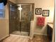Clean bathroom with a glass-enclosed shower, modern fixtures, and stylish tile work at 3173 Youngheart Way, Castle Rock, CO 80109