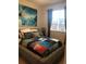 This cozy bedroom features a unique snowboard themed quilt and a large action sports print above the bed at 3173 Youngheart Way, Castle Rock, CO 80109