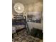 A shared bedroom with bunk beds, playful decor, decorative throw pillows and a distinctive light fixture at 3173 Youngheart Way, Castle Rock, CO 80109