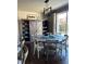 Charming dining room featuring a round table, elegant lighting, and ample natural light at 3173 Youngheart Way, Castle Rock, CO 80109