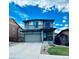Charming two-story home with a well-maintained front yard and a welcoming entrance at 3173 Youngheart Way, Castle Rock, CO 80109